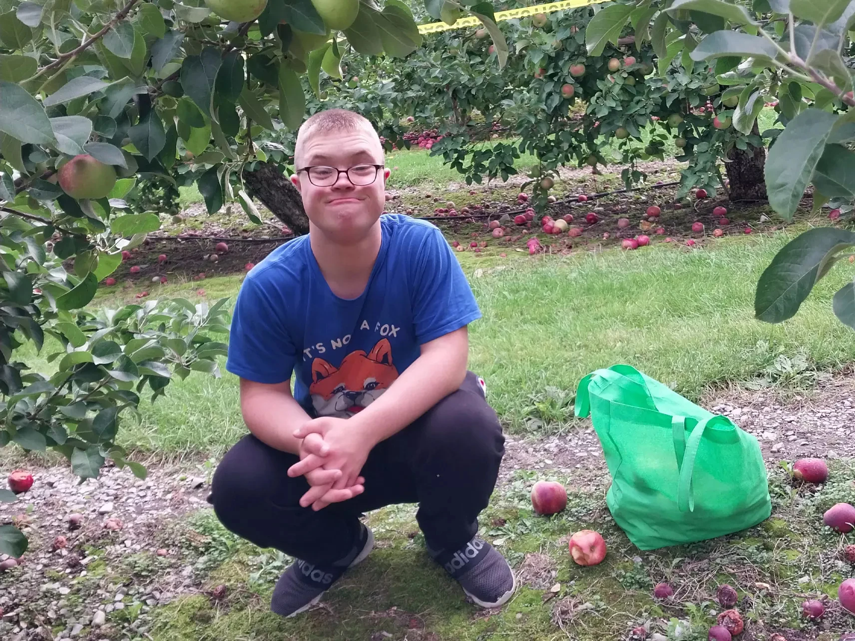 Thomas Grenier in an apple orchard
